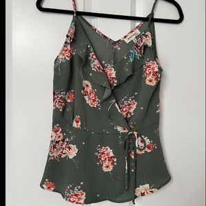 Pale green and flowered sleeveless top